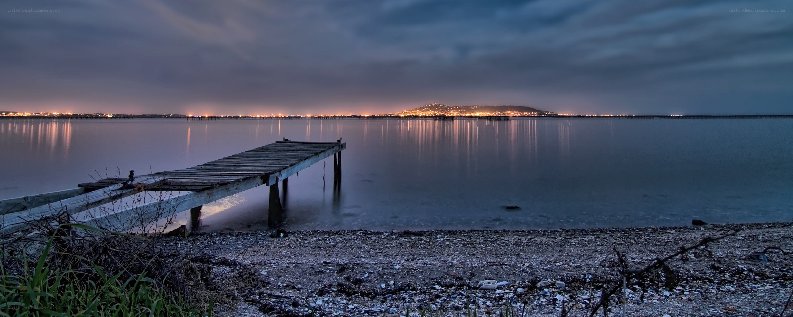 Nighttime pier by the water