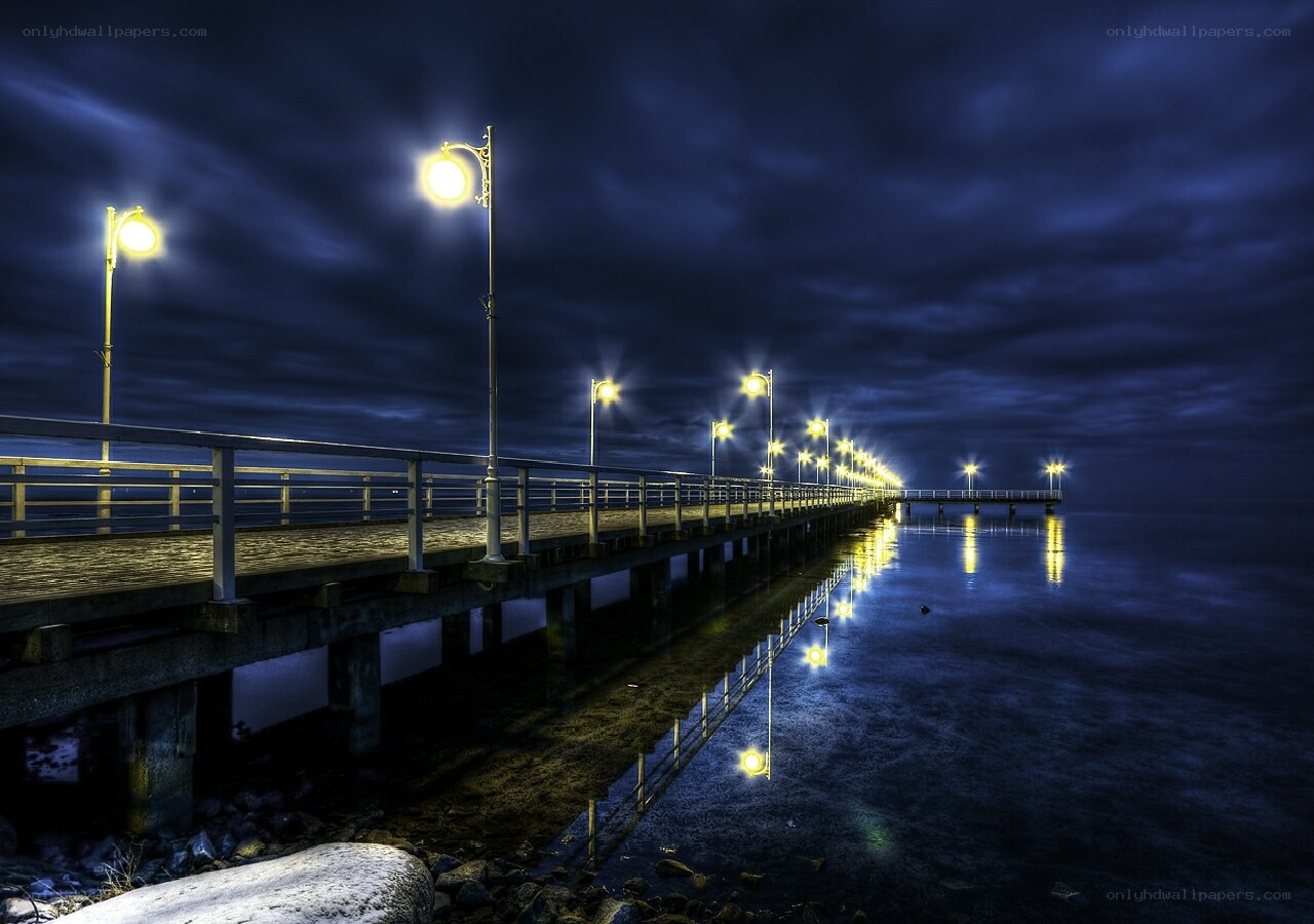 Nighttime pier with streetlights