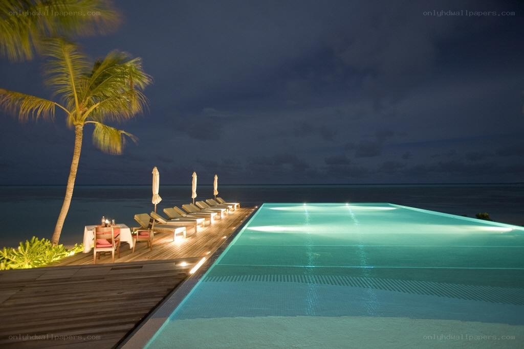 Nighttime pool at a tropical resort