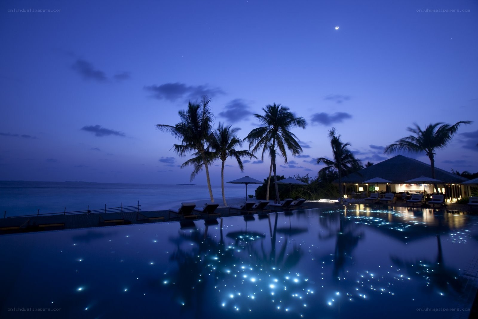 Nighttime pool at tropical resort