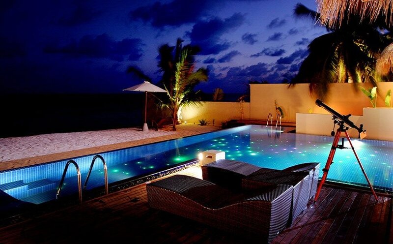 Nighttime poolside relaxation