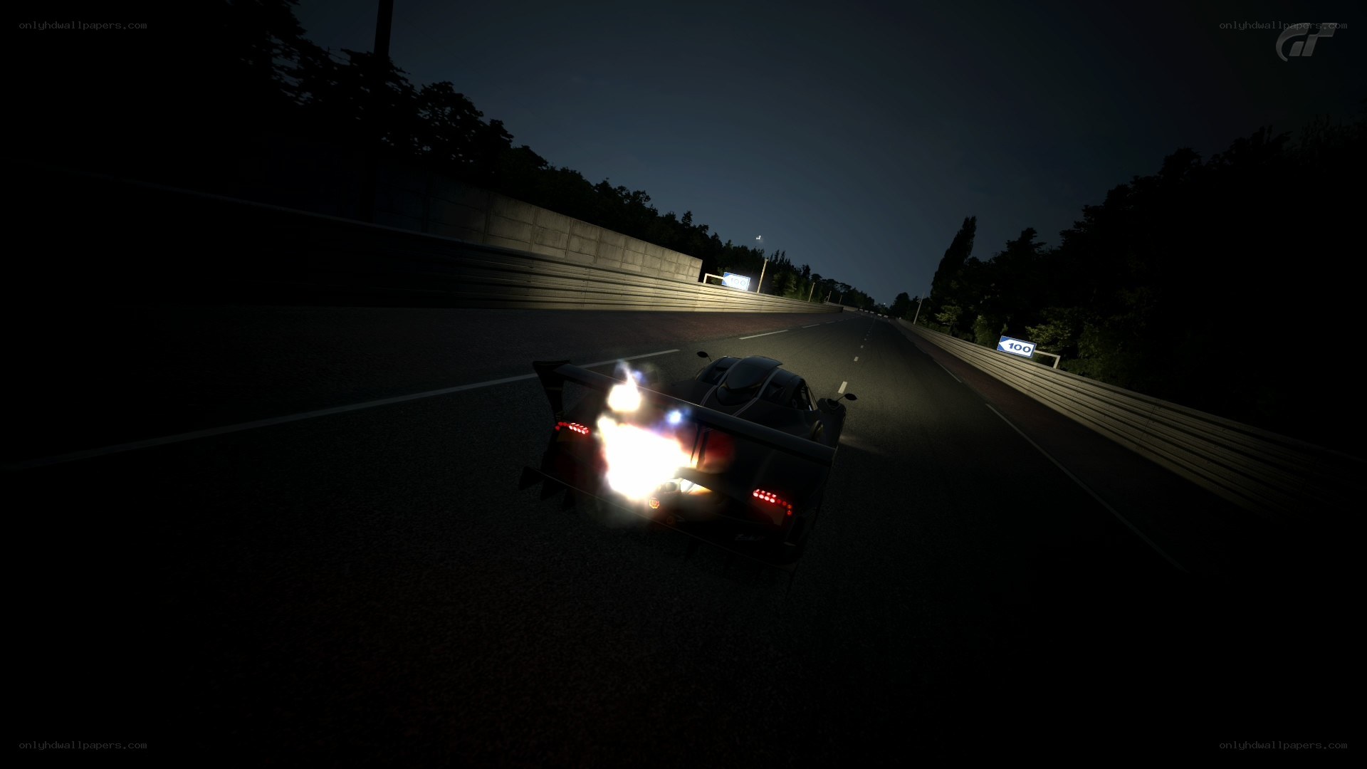 nighttime race car on track