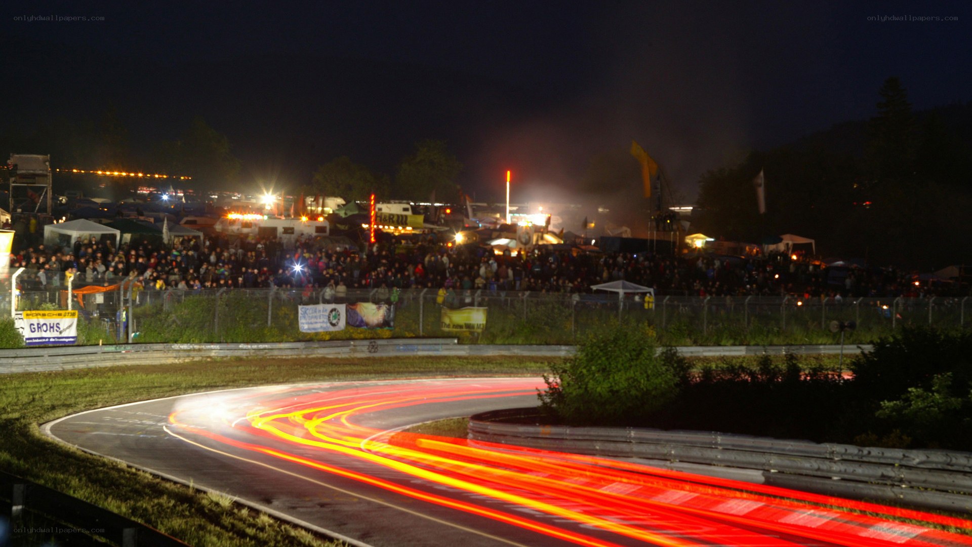Nighttime race track with light trails