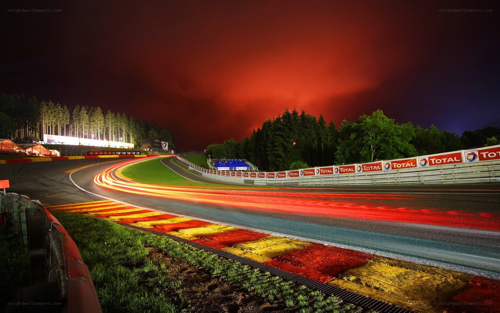 Nighttime race track with light trails