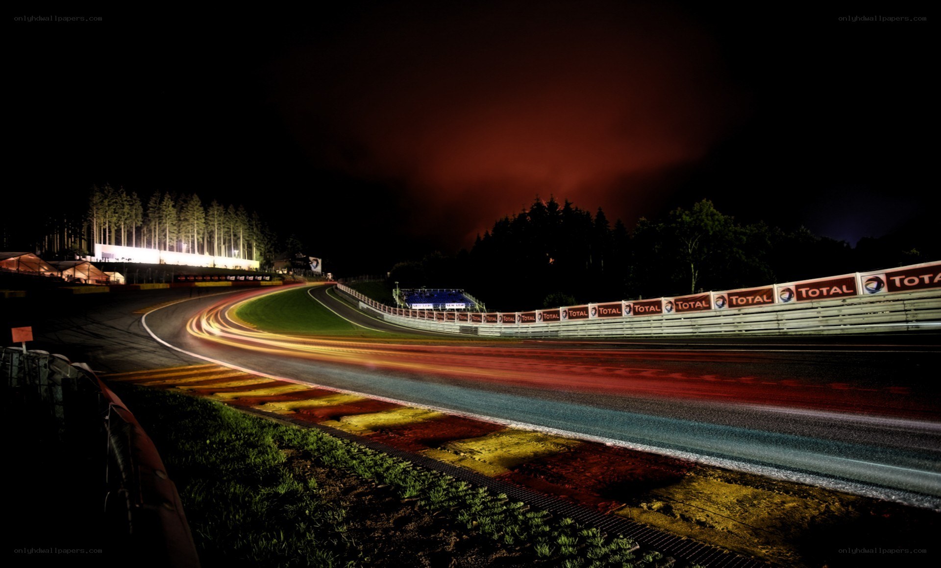 Nighttime race track with light trails