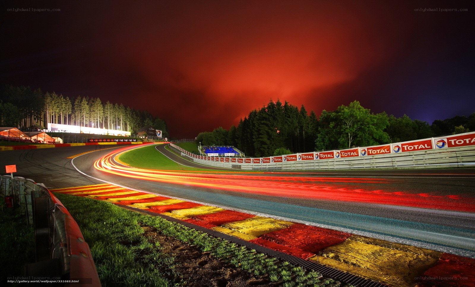 Nighttime race track with light trails