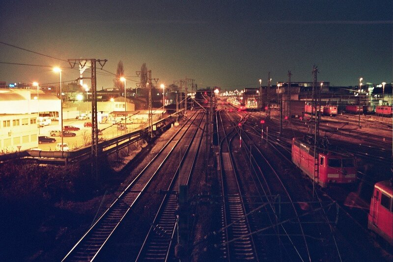 nighttime railway yard scene