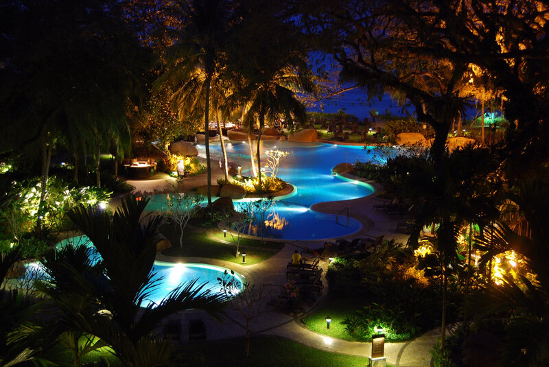 nighttime resort pool area