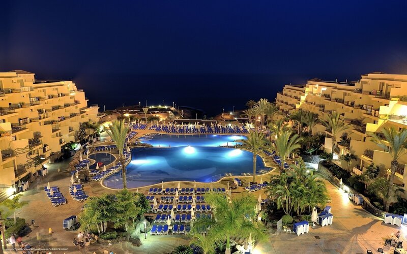 nighttime resort pool view