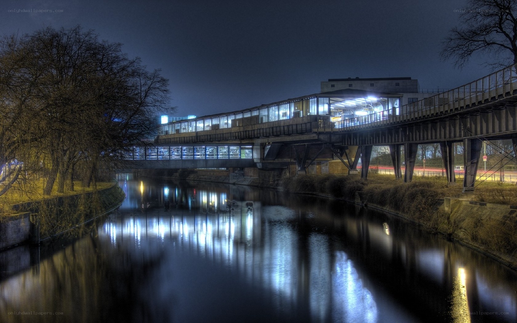 Nighttime river bridge scene