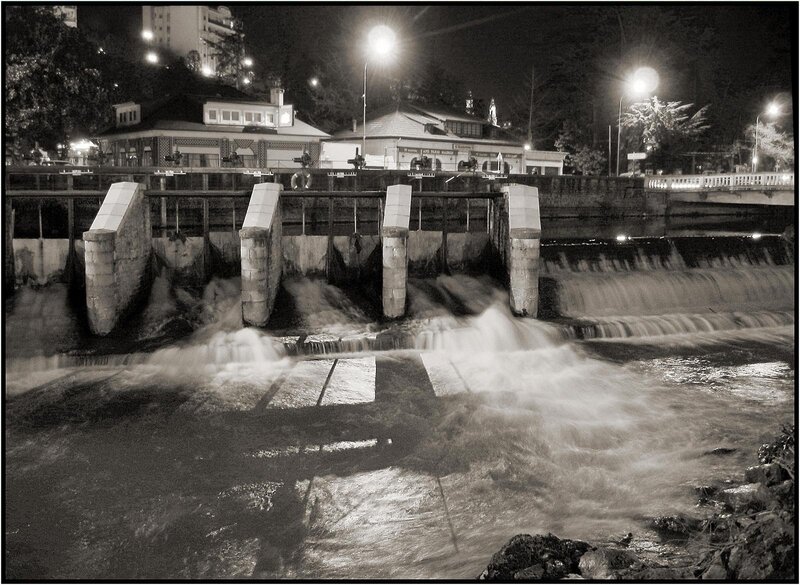 Nighttime river dam scene
