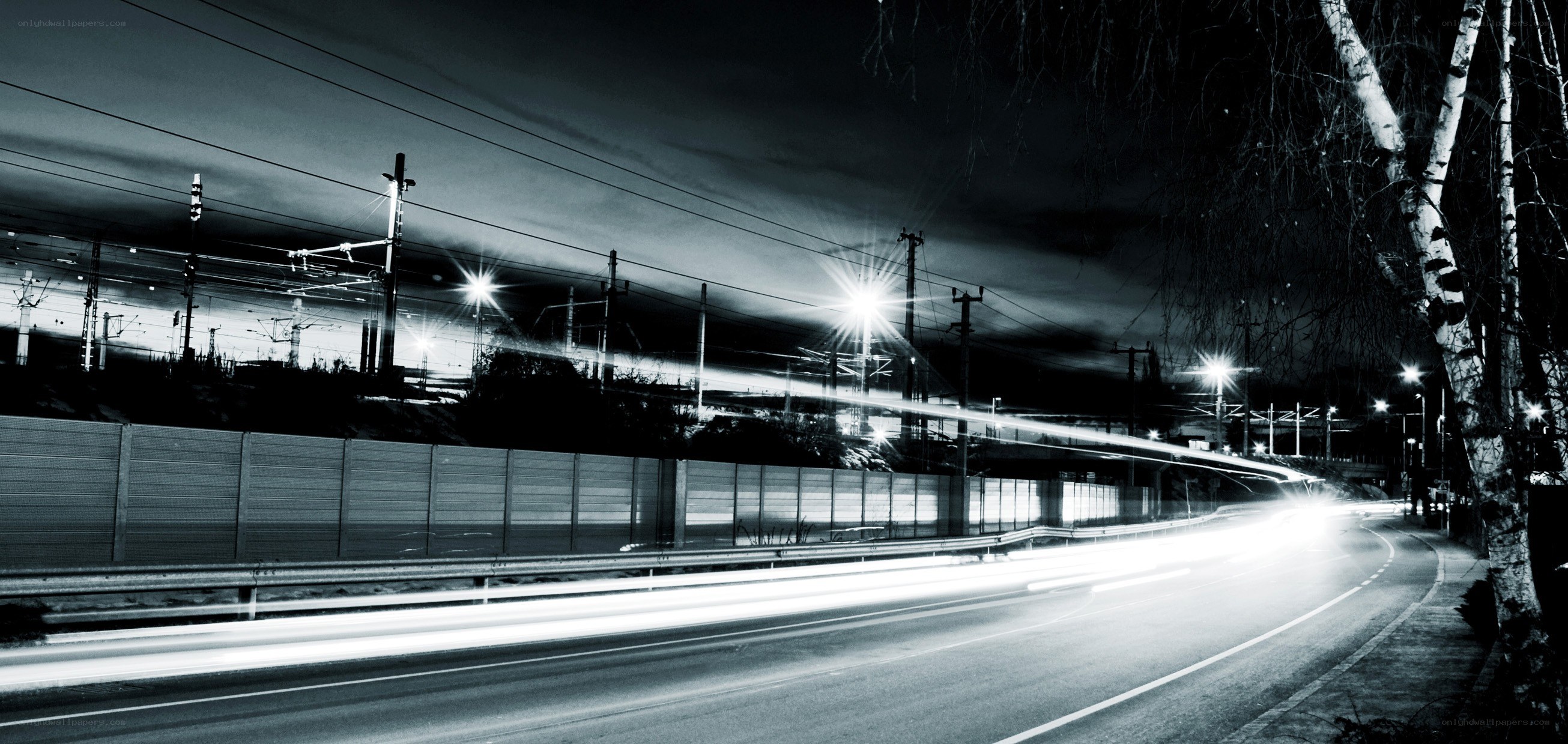 Nighttime road with light trails