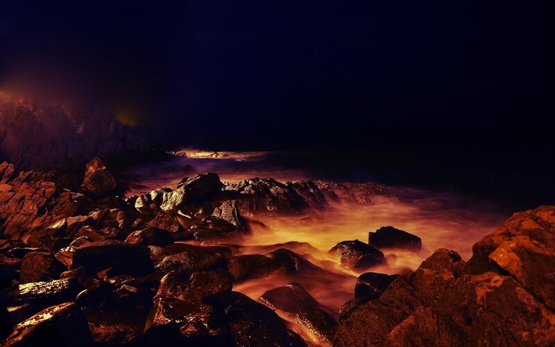 nighttime rocky shoreline