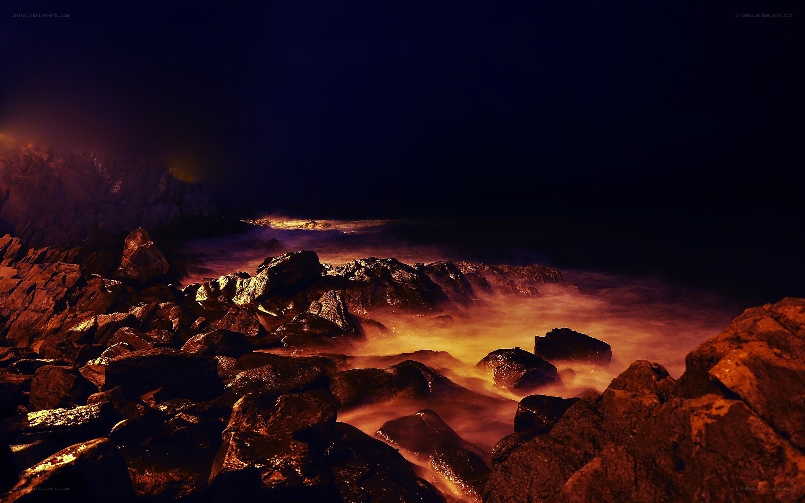 nighttime rocky shoreline