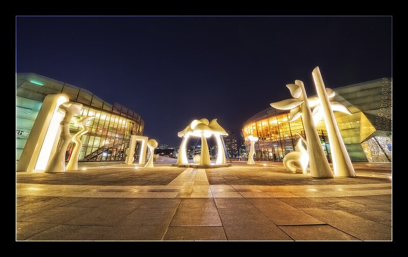 Nighttime sculpture plaza