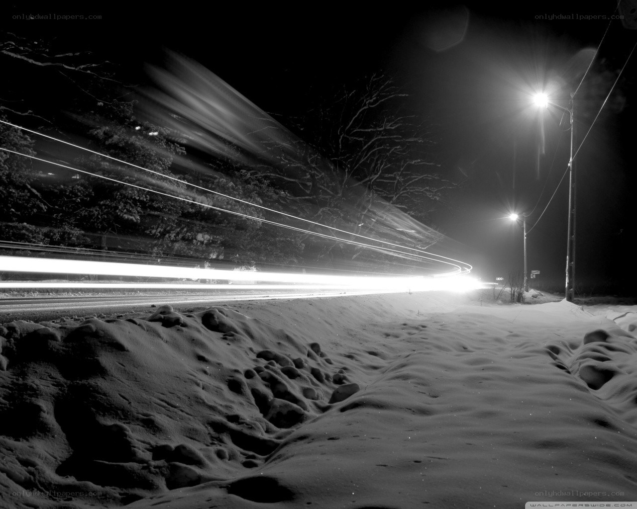 Nighttime snow scene with light trails