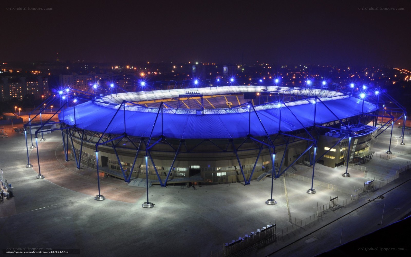 nighttime stadium illuminated blue