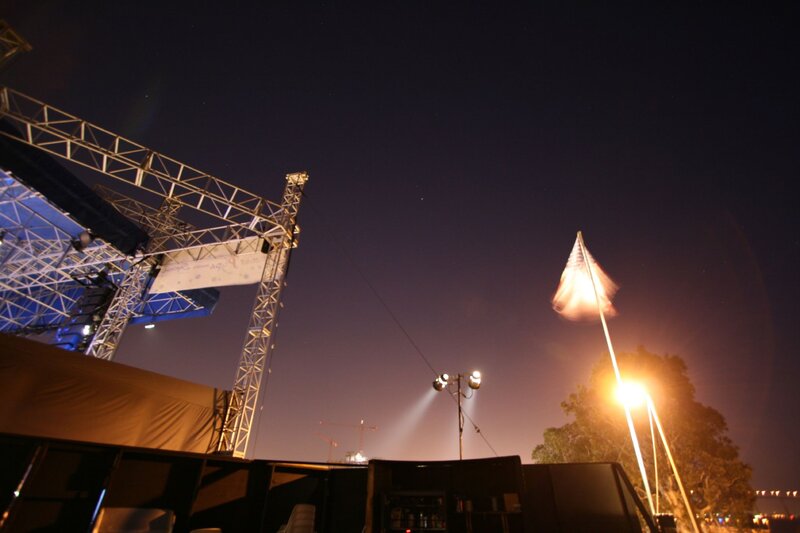Nighttime stage setup with flag