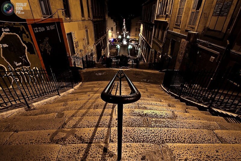 nighttime stairs in a narrow alley