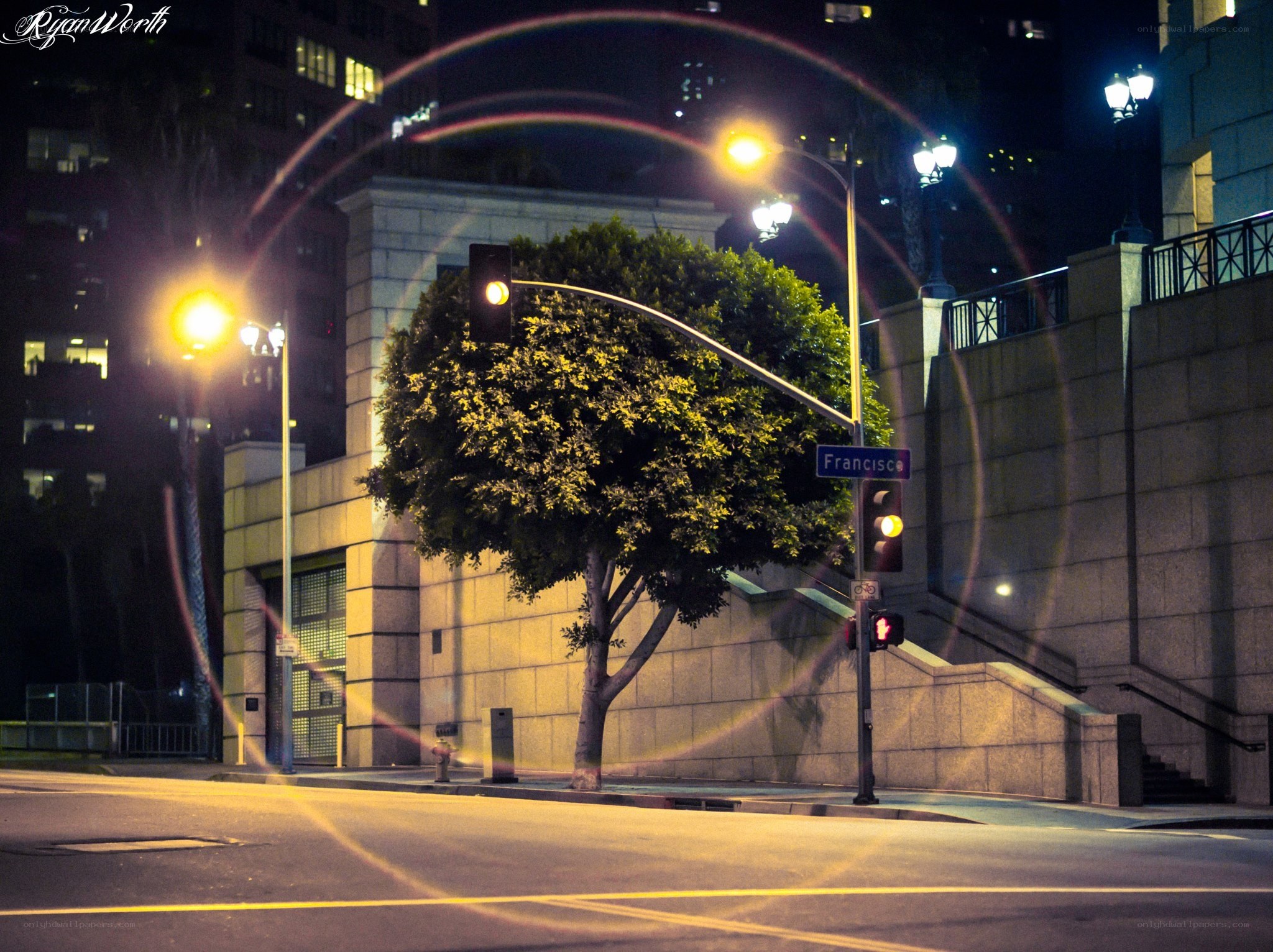Nighttime street corner with lens flare
