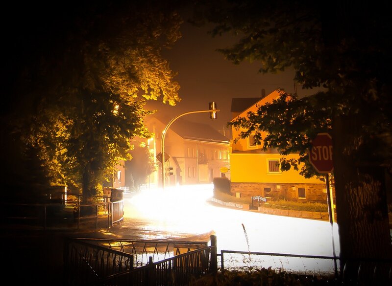 Nighttime street scene in fog
