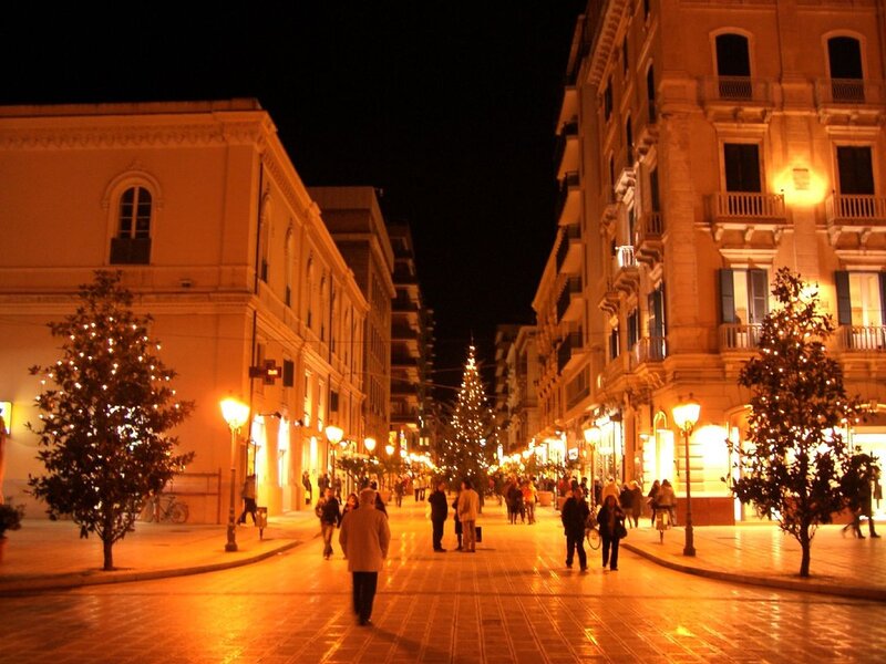 nighttime street scene with christmas lights