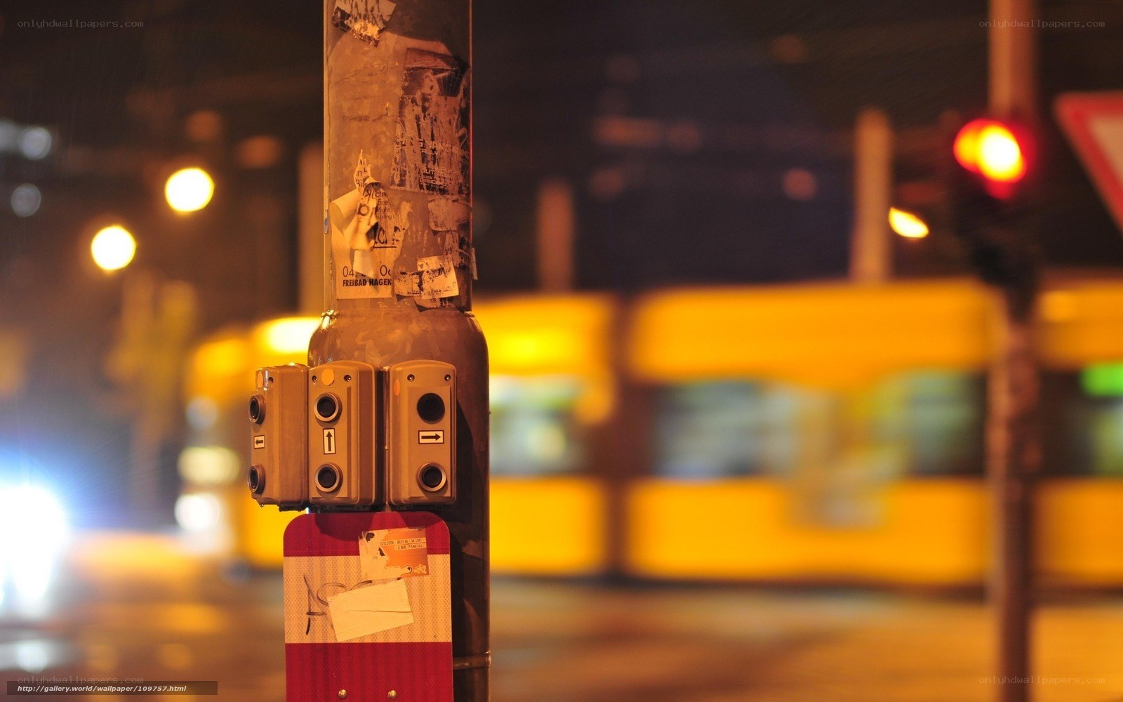 Nighttime street scene with traffic lights