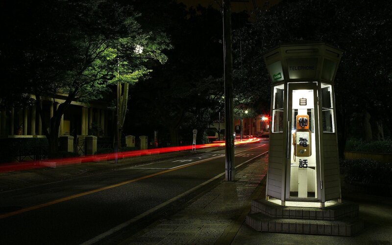 Nighttime street with phone booth
