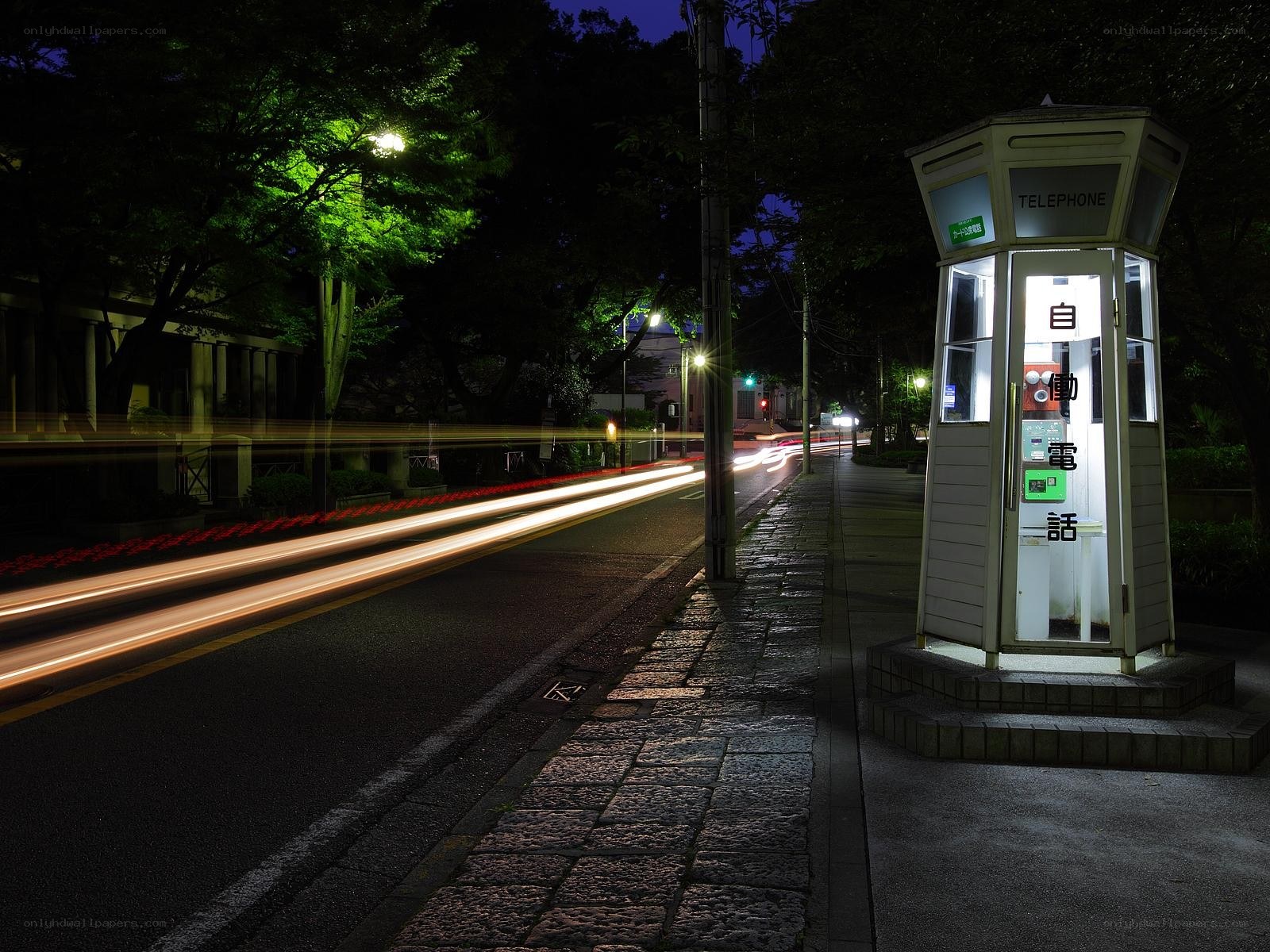 Nighttime street with phone booth