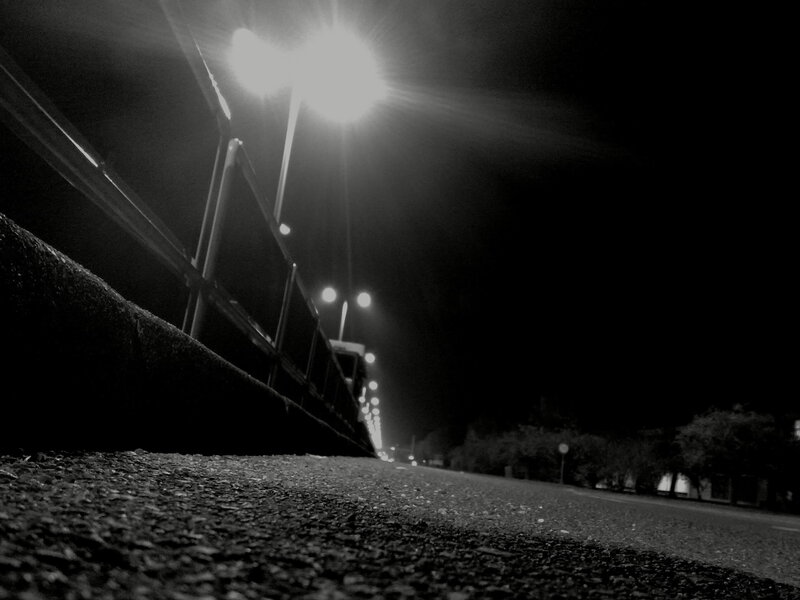 nighttime street with streetlights