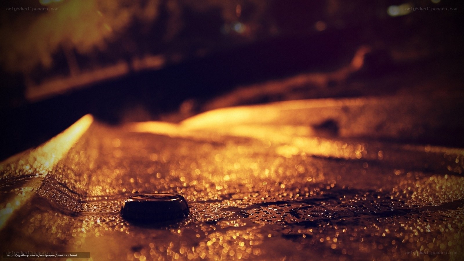 nighttime street with wet pavement