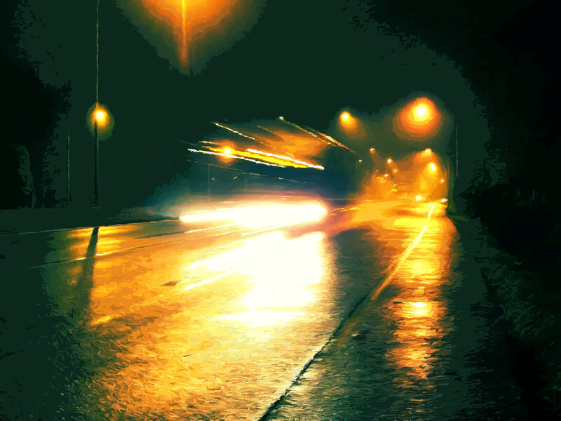 Nighttime street with wet road