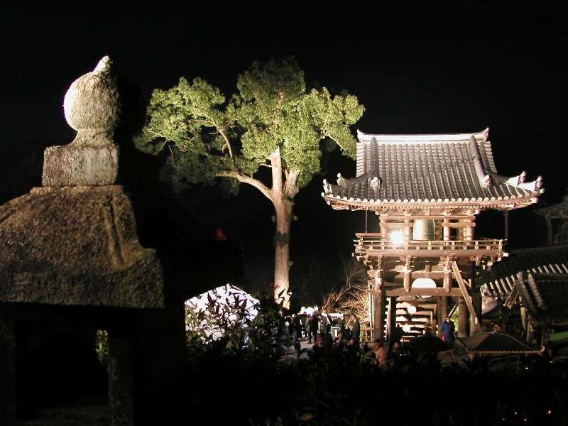 Nighttime temple scene with bell tower
