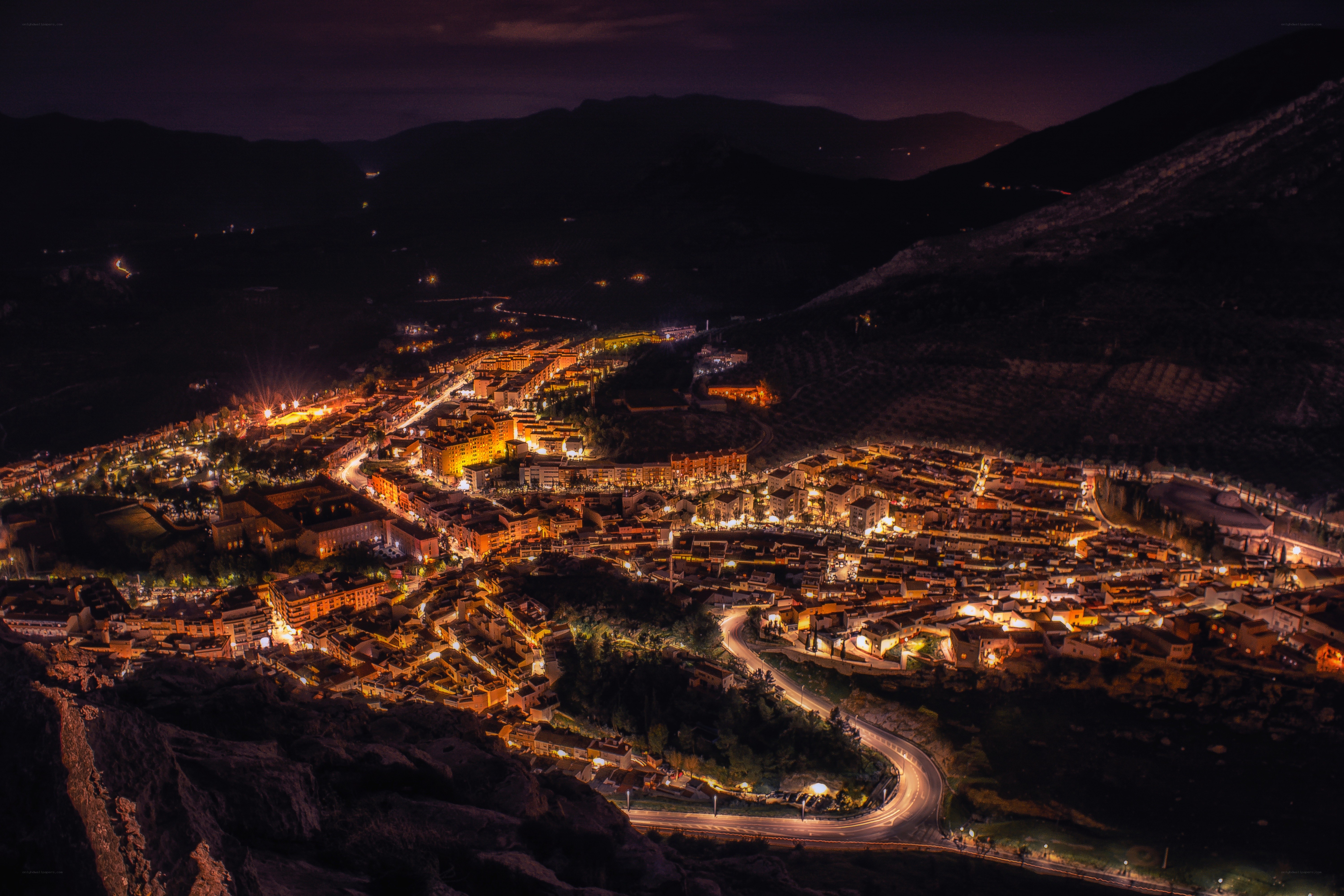 nighttime town in mountain valley