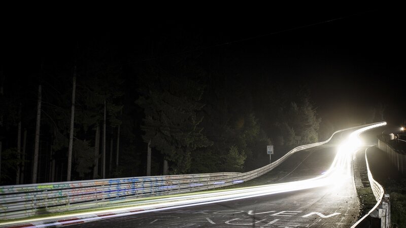 Nighttime track with light trails
