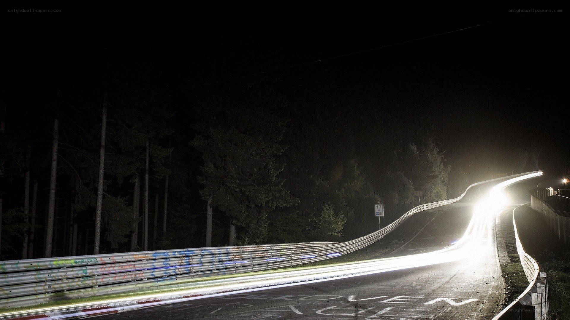 Nighttime track with light trails