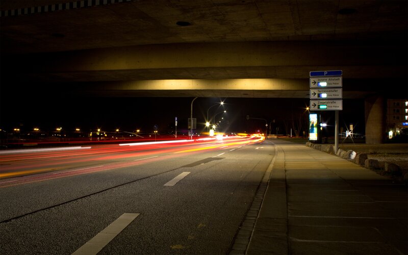 Nighttime traffic under a bridge