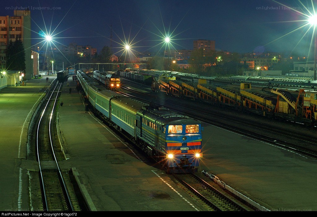 Nighttime train at a railway yard