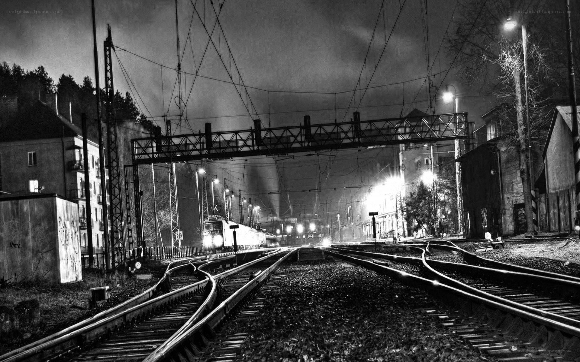 Nighttime train at railway crossing