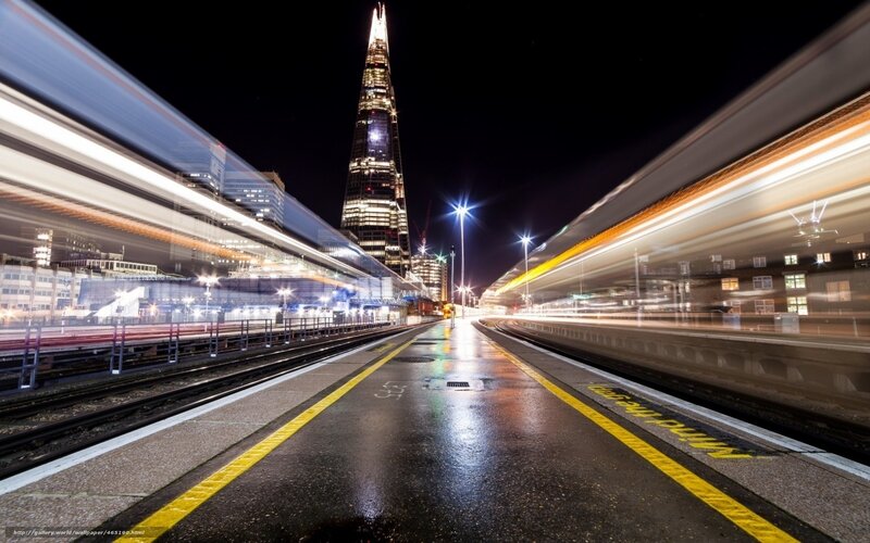Nighttime train station with Shard