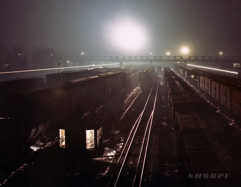 Nighttime train yard in fog