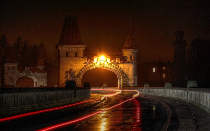 Nighttime view of a historic bridge