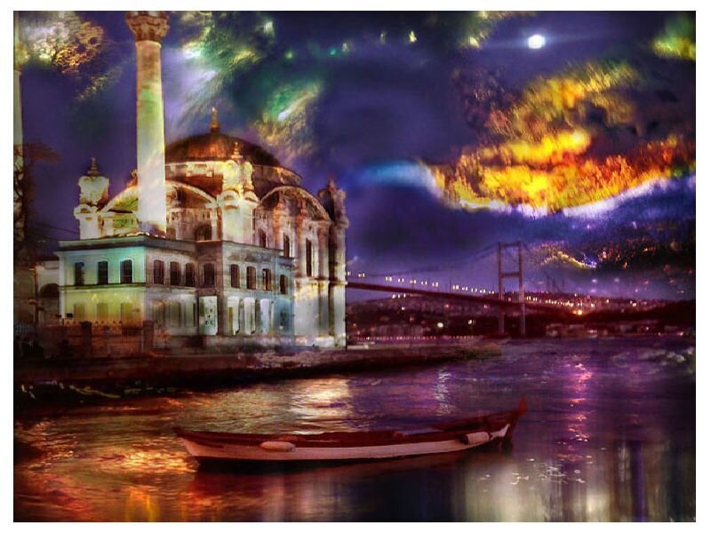 Nighttime view of a mosque by the water