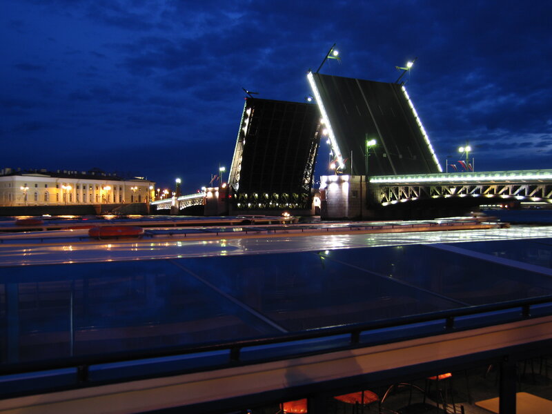 Nighttime view of a raised bridge