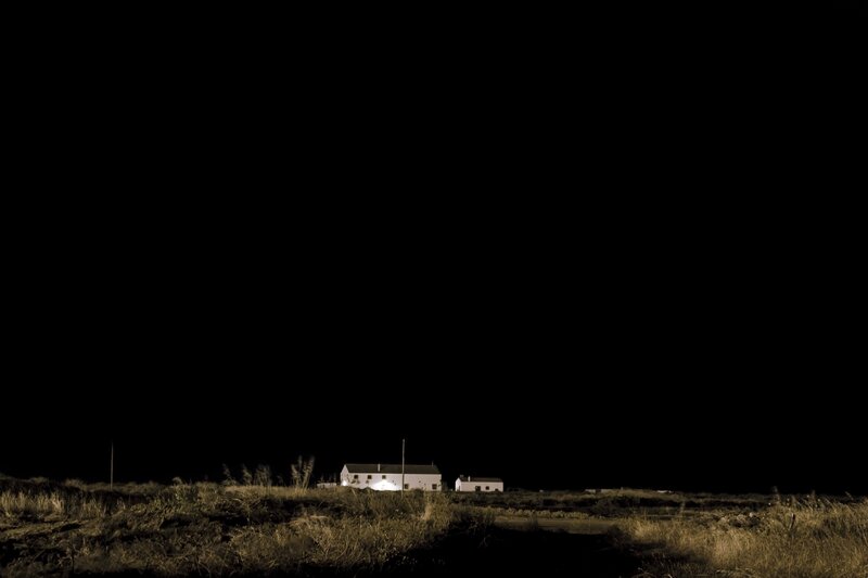 Nighttime view of a rural house
