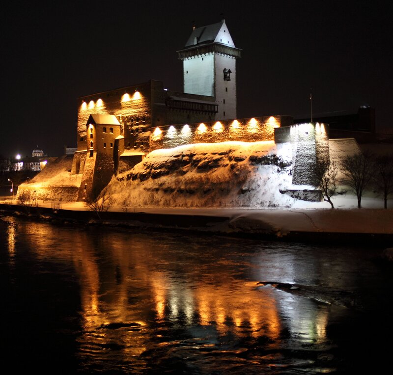 nighttime view of a snow-covered castle