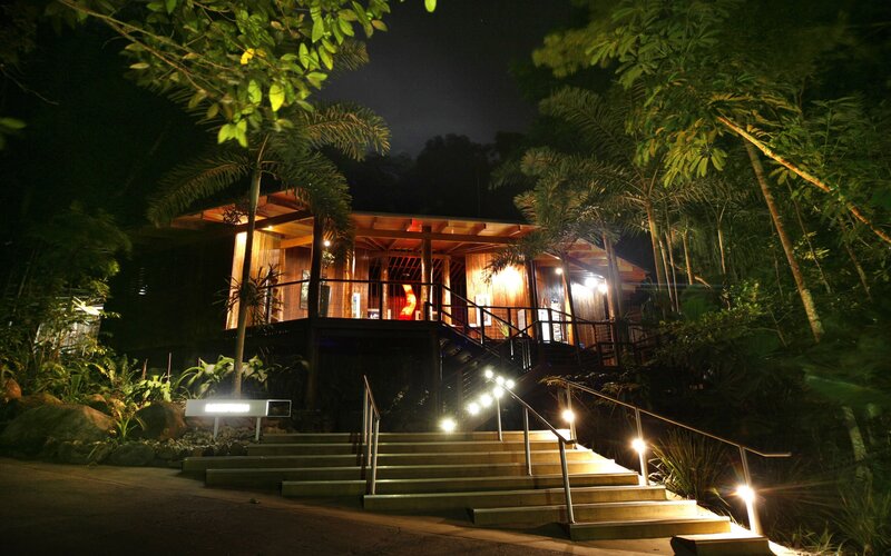 nighttime view of a tropical lodge