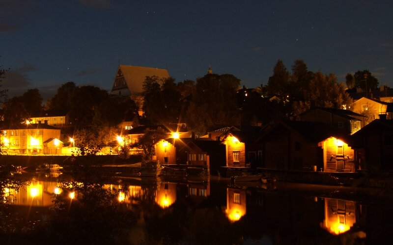 nighttime village by the water