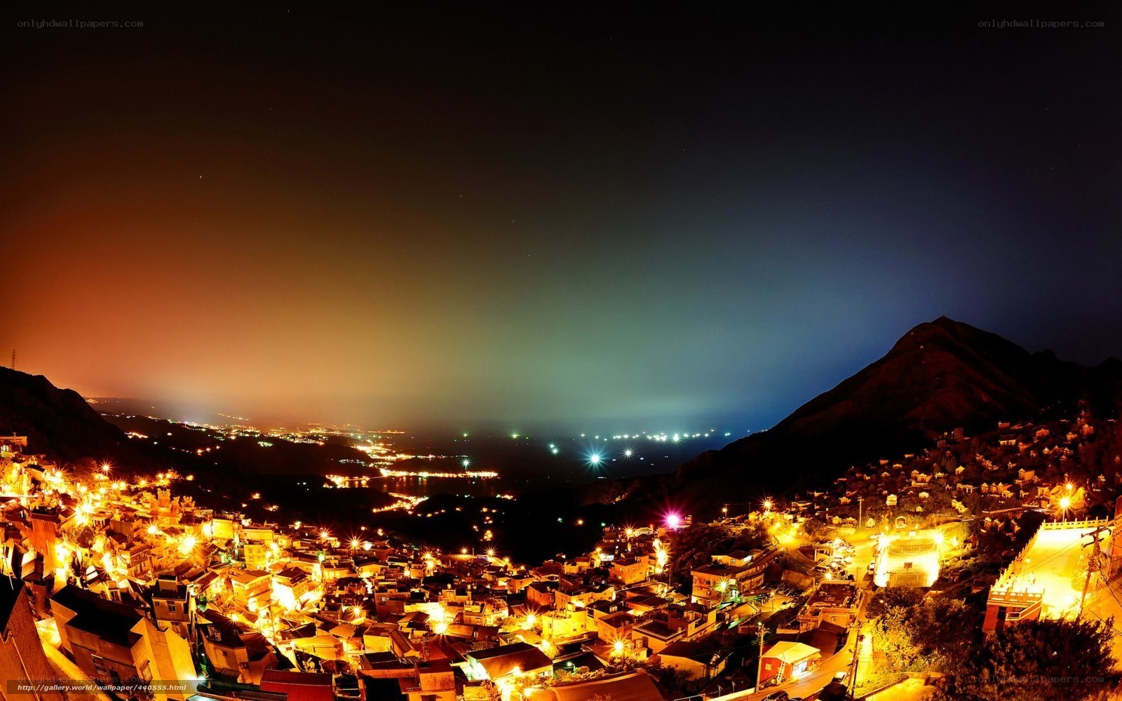 nighttime village on a hillside