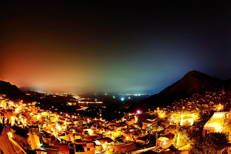 Nighttime Village on Hillside
